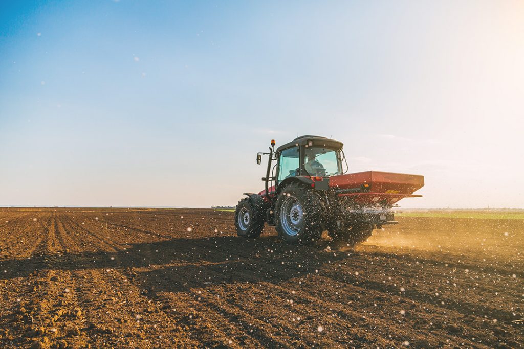 Field planter tractor fertilizing field