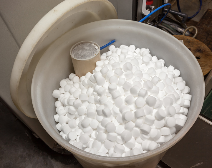 Bucket filled with water softener salts